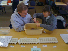 Jug Bay exhibitors, Pete and Kim, sort and identify macroinvertebrates. Jug Bay exhibitors, Pete and Kim, sort and identify macroinvertebrates.